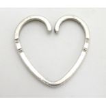 A Danish silver key ring of heart form, marked Georg Jensen, with import marks. 1 1/2" long Please