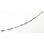 A silver and white metal Albert watch chain. Approx. 12 1/2" long Please Note - we do not make