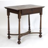 An early 18thC oak side table with a rectangular top above a single long drawer and raised on turned