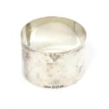 A silver napkin ring hallmarked Birmingham 1947 maker K ltd. Please Note - we do not make
