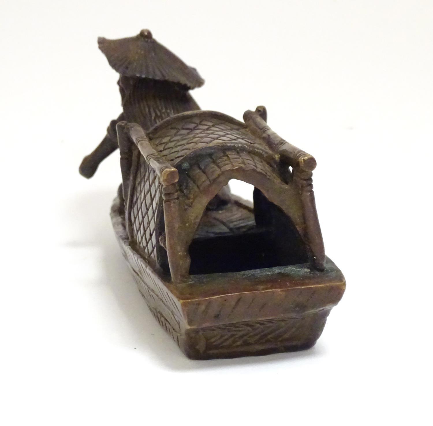 An Oriental bronze model of a fishing boat with a figure fishing. Approx. 6 1/2" long Please - Image 6 of 7