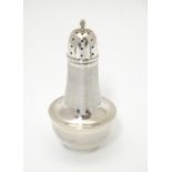 An art Deco silver sugar caster, with Bakelite lining and engine turned decoration. Hallmarked