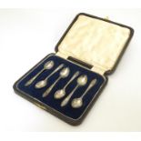 A cased set of six Art Deco silver coffee / tea spoons with Art Deco decoration to handles.