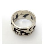 A Mexican silver ring of band form with abstract detail. Ring size approx. O Please Note - we do not