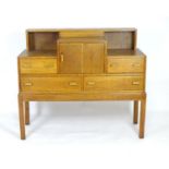 An early / mid 20thC oak Arts & Crafts style sideboard with exposed dovetailing and four short