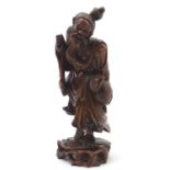 A Chinese carved wooden figure depicting a sage / elder. Approx. 11 1/2" high Please Note - we do