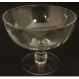 A pedestal glass bowl 6" high x 7" diameter Please Note - we do not make reference to the