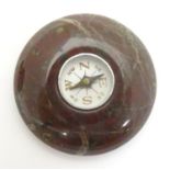 A pocket compass within an agate hardstone mount. Approx. 1 3/4" diameter Please Note - we do not