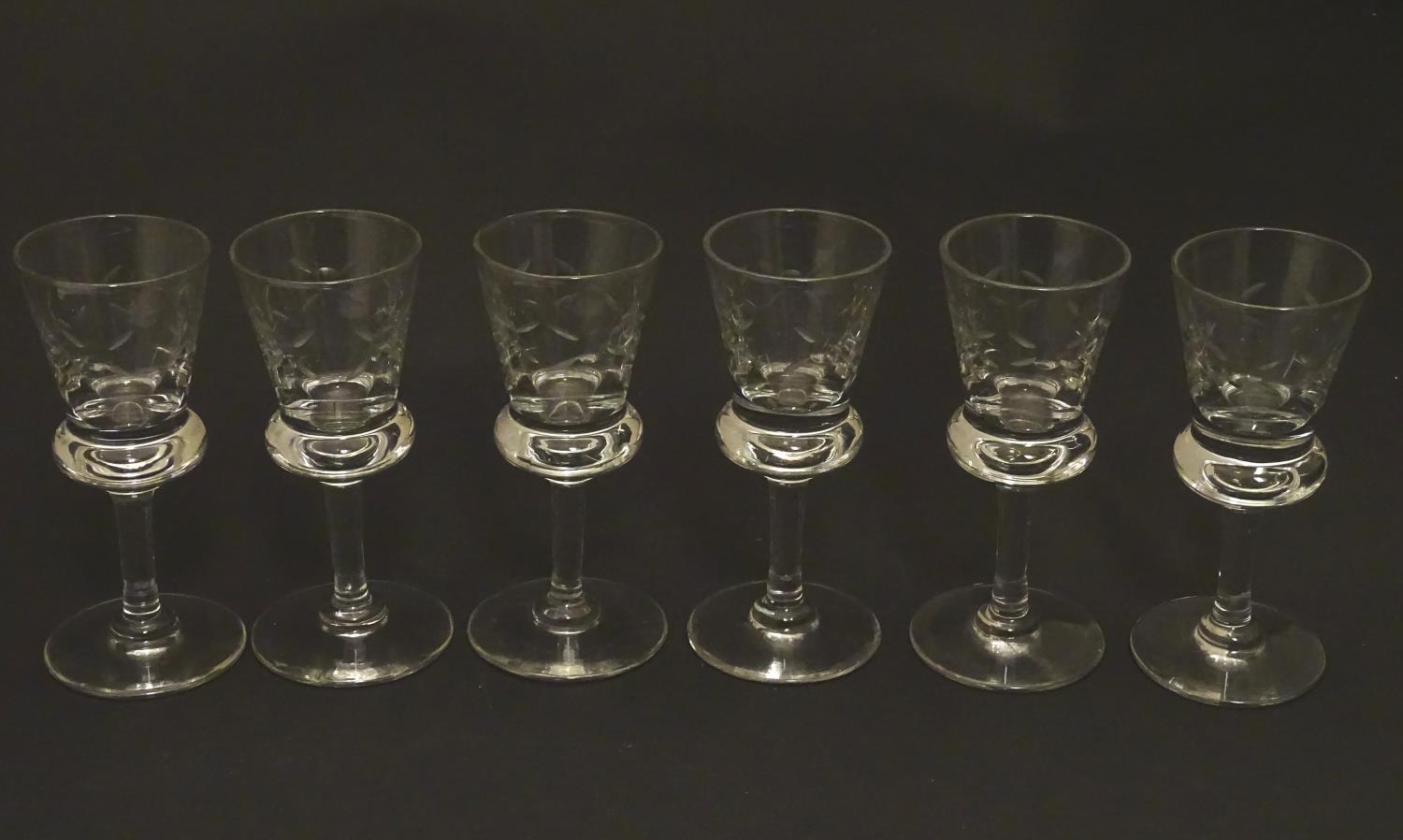 A set of six crystal sherry glasses formed as thistles, with cut roundel decoration, each 4 1/8"
