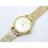 A ladies 18ct gold wrist watch by The International Watch Company, with a 9ct gold strap. Th case