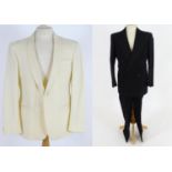 Vintage clothing/ fashion: A vintage men's evening dinner suit with additional cream jacket. Chest