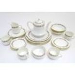 A quantity of Royal Albert tea wares in the pattern Belinda, comprising teapot, milk jug, sugar,