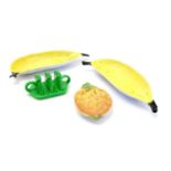 Three items of Carlton Ware fruit ware to include two banana split dishes and a pineapple dish.