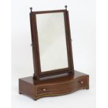 A Regency mahogany dressing table mirror with squared uprights surmounted by turned finials,
