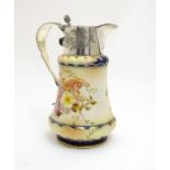 A Wiltshaw & Robinson Carlton Ware jug with floral decoration, with silver plate mounts and