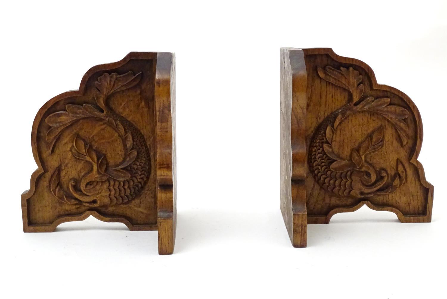 A pair of 20thC bookends with carved fish detail. Approx. 8" long (2) Please Note - we do not make