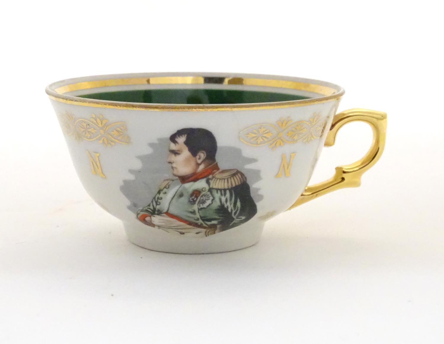 A French tea cup and saucer depicting Emperor Napoleon with green and gilt highlights. Porcelaine de - Image 3 of 10