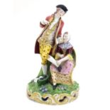 A large Derby porcelain figural group depicting a young couple on a naturalistic base with