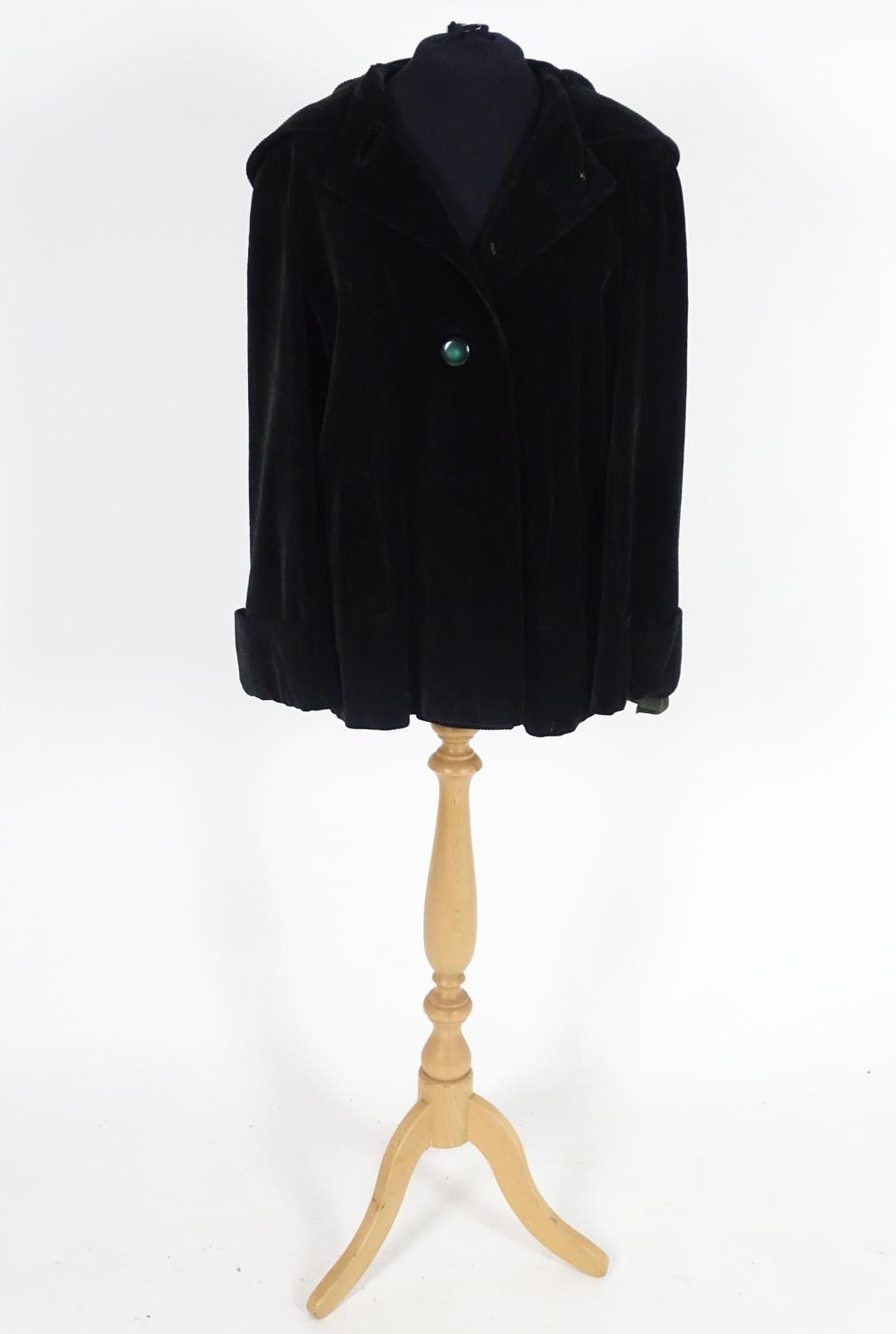 Vintage clothing/ fashion: A Vintage ladies black short corduroy hooded jacket, buttoned to front.