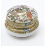 A Japanese Noritake circular pot and cover with hand painted decoration depicting a Geisha girl in a