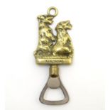 A bottle opener with brass decoration depicting two Sealyham terrier dogs. Titled ' Sealyhams' 5"