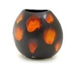 A Poole Pottery purse vase in the living glaze galaxy pattern. Marked under. Approx. 7" high