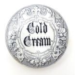 An early 20thC pot lid for Cold Cream with monochrome decoration. Approx. 3" diameter Please