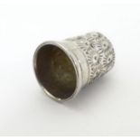 A small silver thimble hallmarked Birmingham 1903 together with a folding fruit knife approx 1 1/