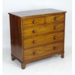 A late 19thC mahogany chest of drawers with a rectangular top above two short over three long