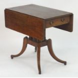 A Georgian oak Pembroke table with drop flaps, a pedestal base with four turned columns and the