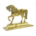A Victorian brass door stop in the form of a horse on a rectangular plinth. Approx. 7 1/2" high