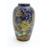 A Wiltshaw and Robinson Carlton Ware baluster vase decorated in the pattern Rockery and Pheasant,