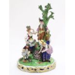A large Derby porcelain figural group garden scene, depicting men, women and children tending to and