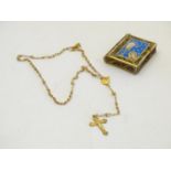 An early 20thC gilt rosary within a gilt filigree case formed as a book / bible with enamel JHS