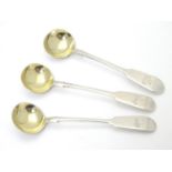 A set of three silver fiddle pattern salt spoons with gilded bowls. Hallmarked Exeter 1879 maker