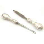 Two silver handled manicure tools, hallmarked Birmingham 1913, maker Boots Pure Drug Company.