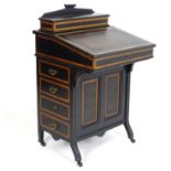 An Aesthetic movement Davenport with an inset leather writing slope above a panelled painted base.