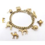 A 9ct gold charm bracelet set with various 9ct gold charms Please Note - we do not make reference to