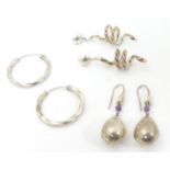 3 pairs of assorted silver and white metal drop earrings. Approx 2" long Please Note - we do not
