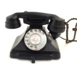 An early 20thC GPO Bakelite black rotary dial telephone, no. 200. Approx. 5" high Please Note - we