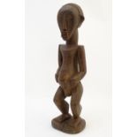 Ethnographic / Native / Tribal: A carved wooden figure depicting a standing man. Approx. 22" high