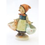 A German Hummel figure Mother's Darling, no. 175. Marked under. Approx. 5 3/4" high. Please Note -