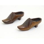 A pair of 20thC carved miniature clogs. Approx. 3 3/4" long (2) Please Note - we do not make