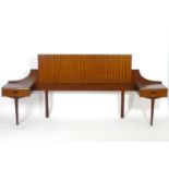 Vintage retro, mid-century: an afrormosia double bed headboard with integral side tables, 90" wide