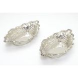 A pair of silver plate bon bon dishes with pierced decoration. Approx. 6" long (2) Please Note -