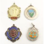 An assortment of hallmarked silver pendant fob sporting medals, each obverse decorated with enamel