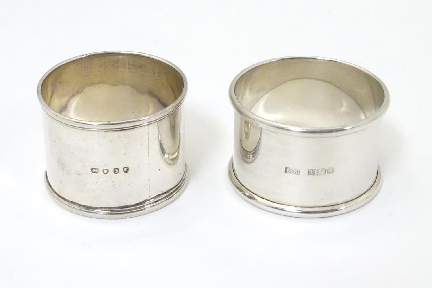 Two silver napkin rings, one hallmarked London 1844, the other Birmingham 1986 (2) Please Note -