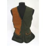 Sporting / Country pursuits: A Musto skeet vest / clay shooting gilet in green. Size M, new with
