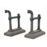 A pair of late Victorian cast iron andirons / firedogs, the terminals with fleur de lys