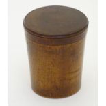 A 19thC treen turned boxwood cylindrical container with screw fitting lid. Approx. 3 1/8" high.